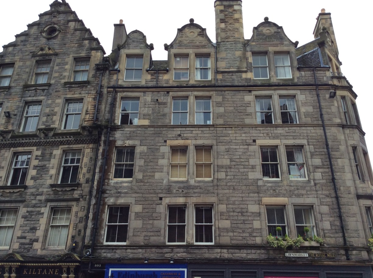 Tenements on the Royal Mile at Lawnmarket. 'Tenements' used to just refer to apartment buildings; the term gained its negative connotation later