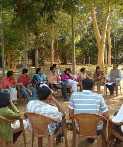 Group discussion in the camps of Nirman (cropped), by Abhijeet Safai, Public Domain via Wikimedia Commons
