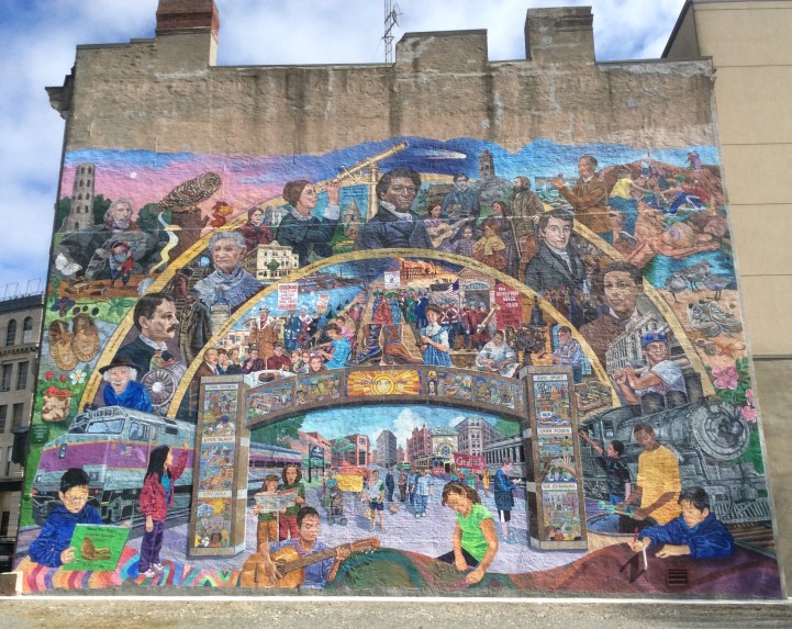 Mural on wall of Lynn's greats on the side of Lynn Arts Building, crowned by portrait of Frederick Douglass Portrait, Lynn MA