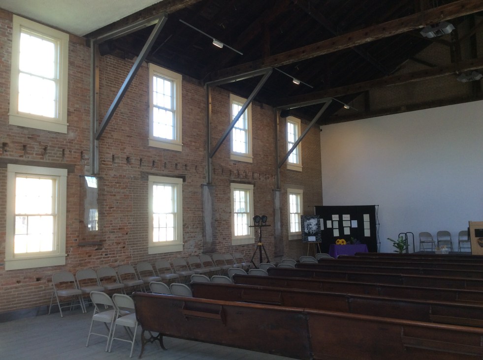 Interior of the rebuilt and restored Wesleyan Church. It went through several remodels and incarnations as various businesses, but much of the original brickwork remained, including some of the original plaster underneath layers of paint and later interior walls
