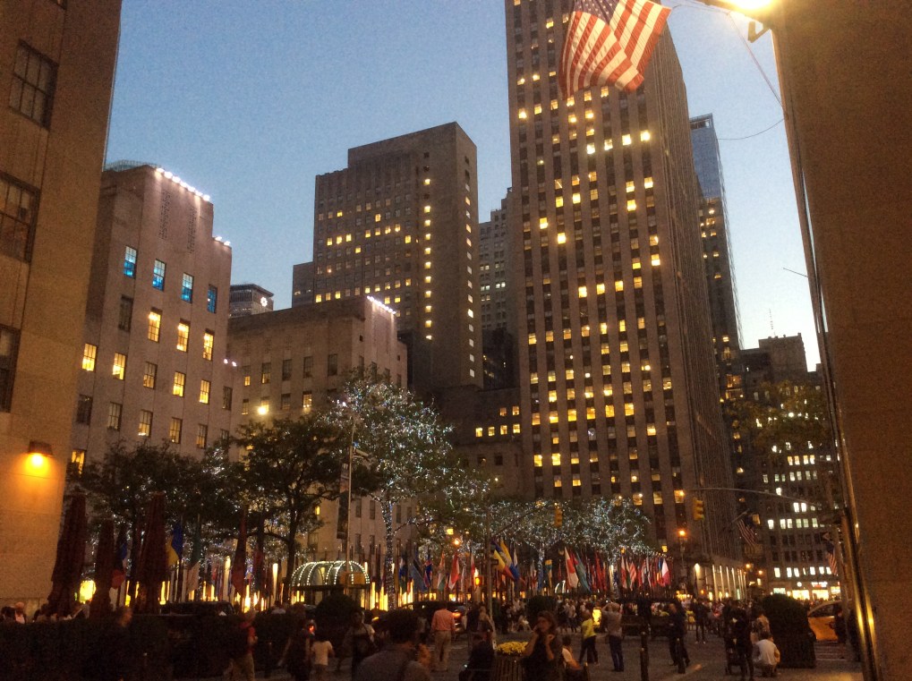 New York City rising above the Rockefeller Center's skating rink on a fall evening