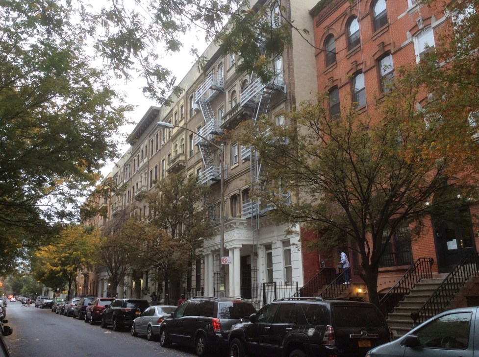 141 W. 111th St, Harlem, NYC, at center with white Kenosha porch, photo by Amy Cools 2016